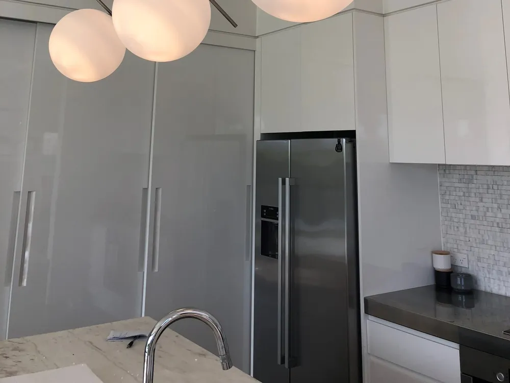 New kitchen with globe pendant lighting above the island